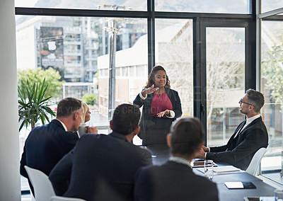 Buy stock photo Presentation, leadership with woman and colleagues in a business meeting in a boardroom of their workplace together. Planning or brainstorming, teamwork or collaboration and coworkers in office