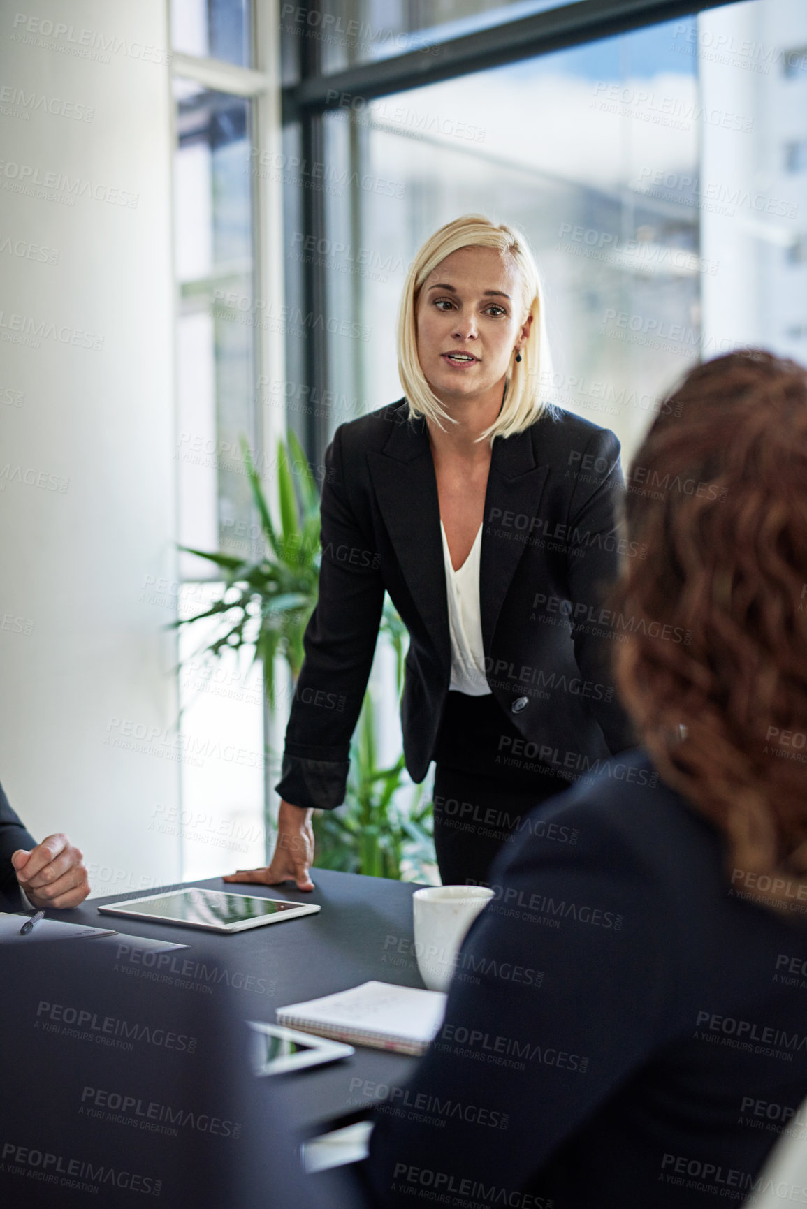 Buy stock photo Shot of corporate businesspeople meeting in the boardroom