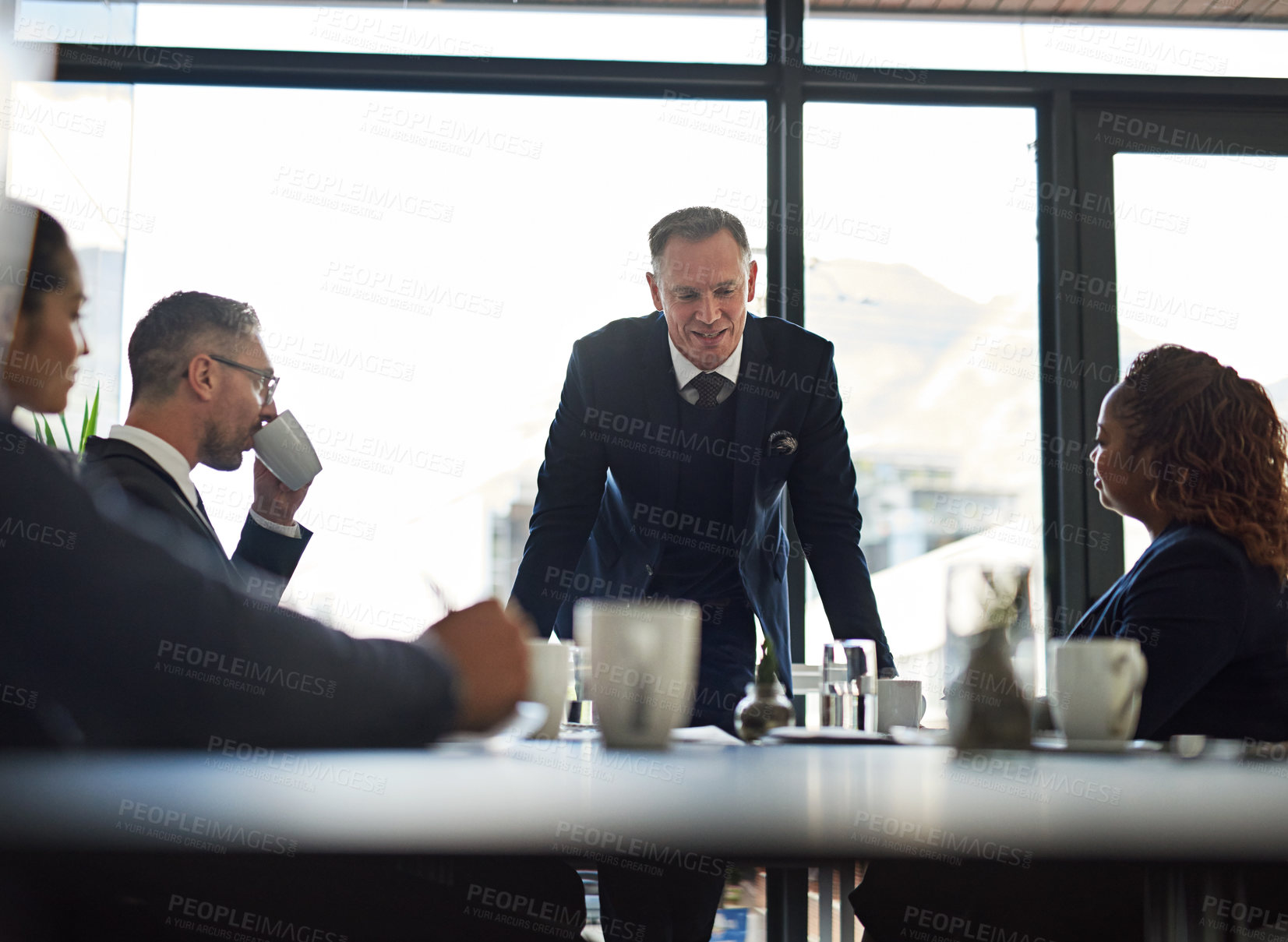 Buy stock photo Shot of corporate businesspeople meeting in the boardroom