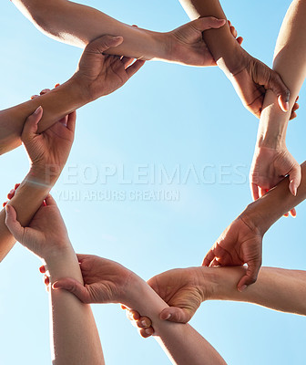 Buy stock photo Hands, chain and circle with team and blue sky with low angle, solidarity and trust with arm link and people together. Teamwork, motivation and connection with group collaboration and community