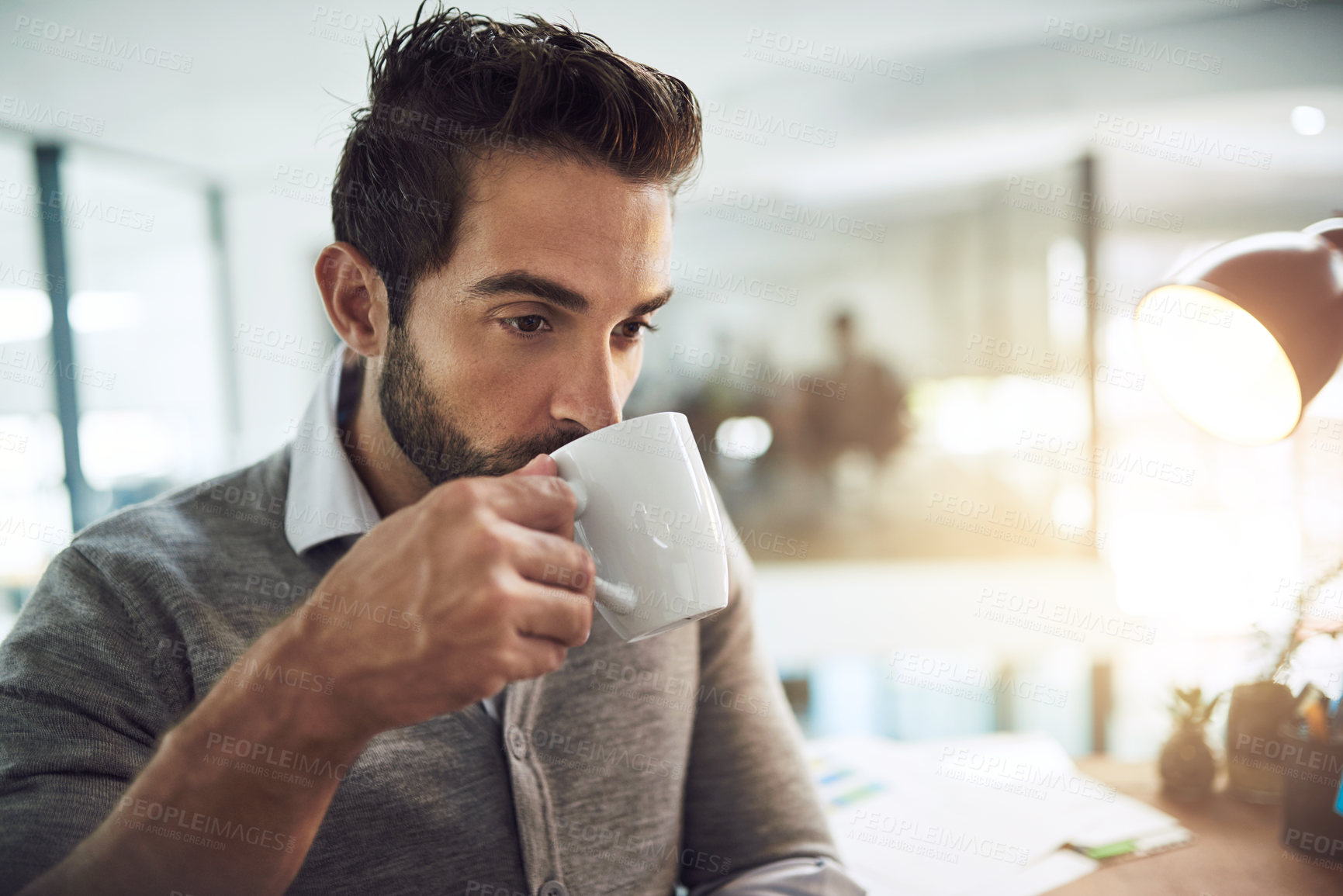 Buy stock photo Businessman, drinking and night with coffee at office for caffeine beverage, cappuccino or latte. Man or employee working late or thinking with cup or mug in wonder or thought for business decision