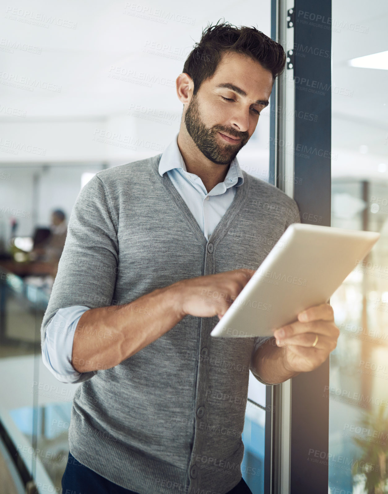 Buy stock photo Employee, leaning and man with tablet, typing and internet for online news, connection or research for article. Person, copywriting or journalist with technology, answer email or app for social media