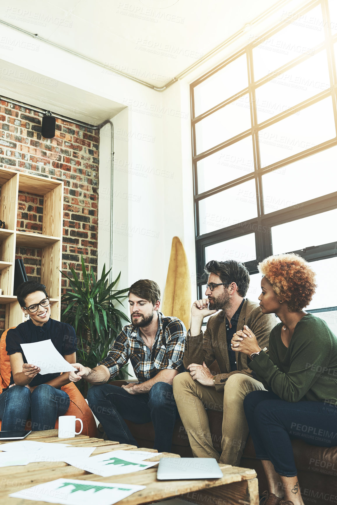 Buy stock photo People, documents and discussion in lounge at startup for charts for progress, stats or info at small business. Team, women and men with paperwork, review or meeting for solution at creative agency