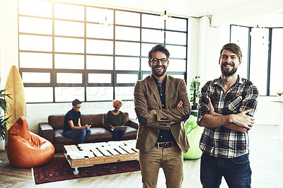 Buy stock photo Shot of two designers standing in a modern office