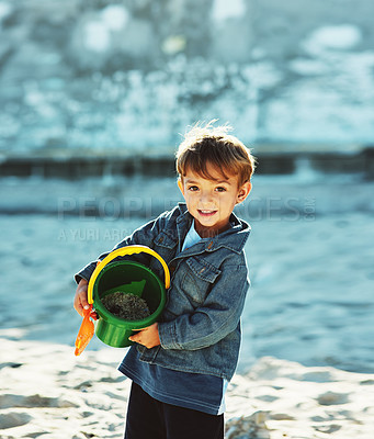 Buy stock photo Shot of a young boy at the beach