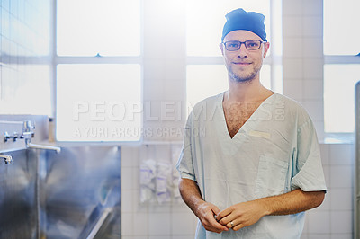 Buy stock photo Portrait of a confident young surgeon working in a hospital
