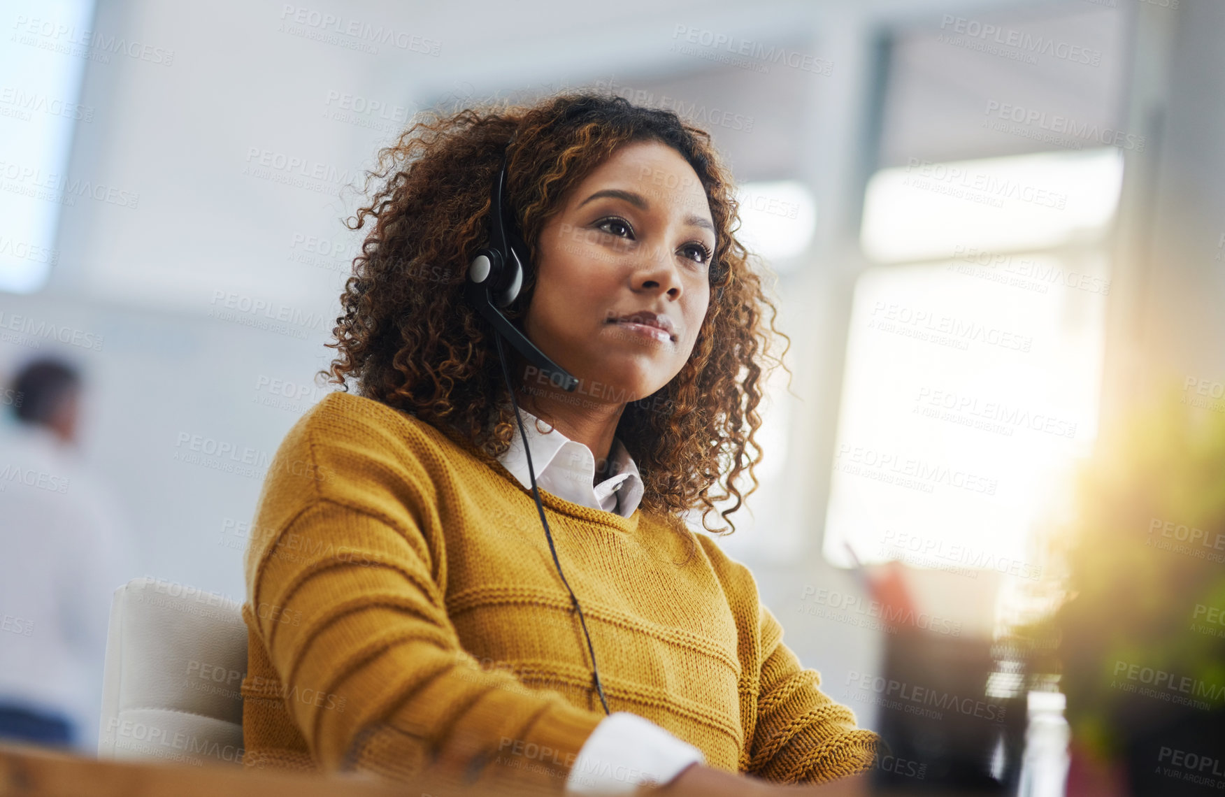 Buy stock photo African woman, call center agent or customer service with focus, listen or voip communication for consulting. Female consultant, tech support or crm for contact, headphones or microphone at help desk