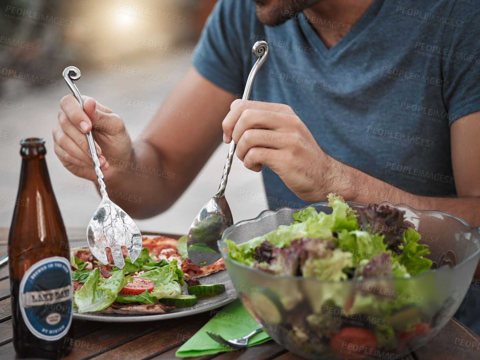 Buy stock photo Cutlery, hands and salad with person outdoor in backyard of home for break, drinking or eating. Beer, food and meal with healthy vegetable snack on wooden table for cuisine, diet or organic nutrition