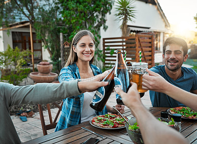 Buy stock photo Lunch, alcohol and people in garden for toast, celebration and connection for bonding together. Outdoor, smile and friends with beer bottle in social gathering, cheers or salad as food for nutrition