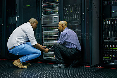 Buy stock photo Server room, men or technicians talking about hardware together for a cybersecurity glitch with teamwork. IT support, collaboration or African engineers fixing network for information technology