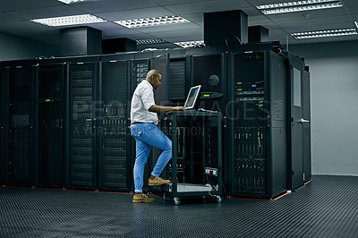Buy stock photo Server room, database and information technology with an engineer man at work on a network mainframe. Computer, programming and cybersecurity with a male technician working in IT support or safety