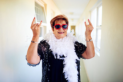 Buy stock photo Shot of a carefree elderly woman wearing glasses and showing hand gestures to the camera