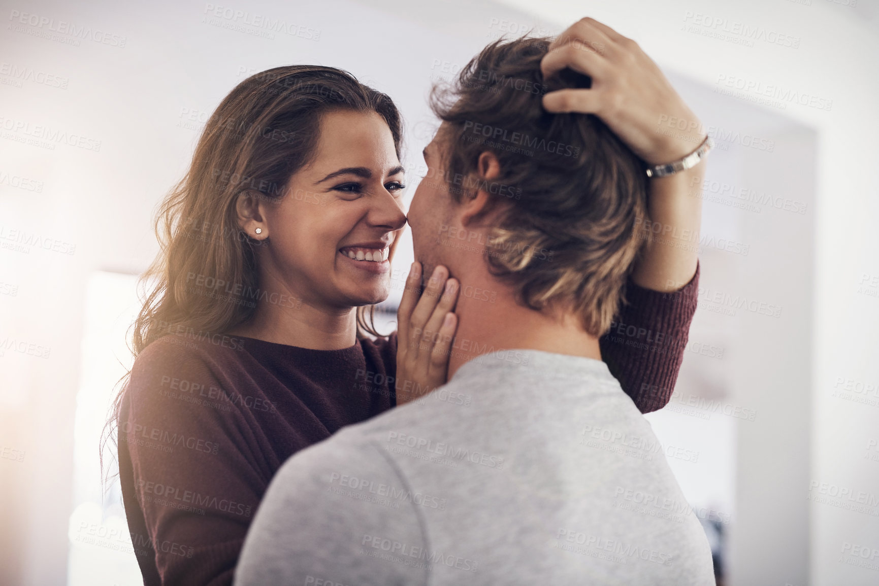 Buy stock photo Smile, love and couple in kitchen with embrace, morning bonding together and affection in home. Romance, happy man and woman hug with care, connection and relax with relationship support in apartment