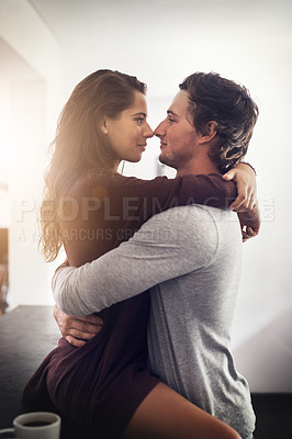 Buy stock photo Intimate, passion and a couple kissing in the kitchen of their home together in the morning for romance. Kiss, love or sexy with a man and woman in their house for romantic intimacy or bonding