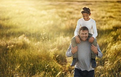 Buy stock photo Shot of a mature man carrying his son on his neck