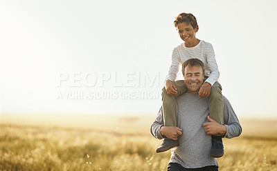 Buy stock photo Shot of a mature man carrying his son on his neck