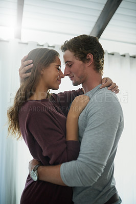 Buy stock photo Shot of a passionate couple standing in their bedroom
