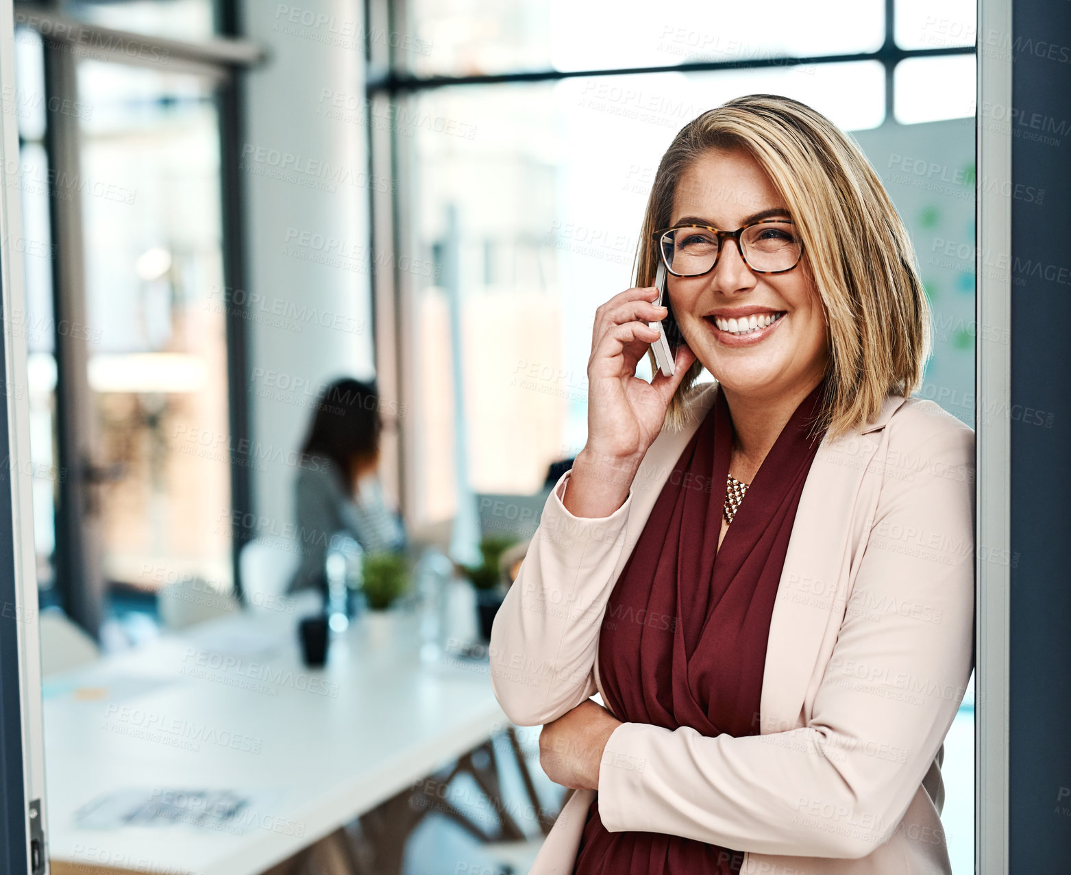 Buy stock photo Shot of a businesswoman talking on a cellphone in an office