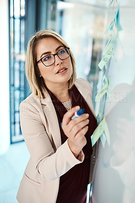 Buy stock photo Workshop, notes and woman at whiteboard in office for agenda, brainstorming or business objectives. Planning, writing and project manager at moodboard with ideas for pitch, proposal or development