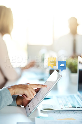 Buy stock photo Shot of an unrecognisable businessperson using a digital tablet in an office