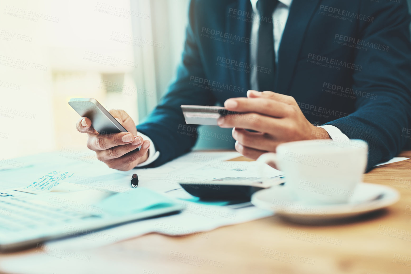 Buy stock photo Shot of an unidentifiable businessman making a credit card payment online