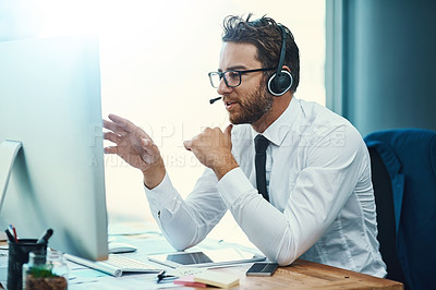 Buy stock photo Shot of a call centre agent working in an office