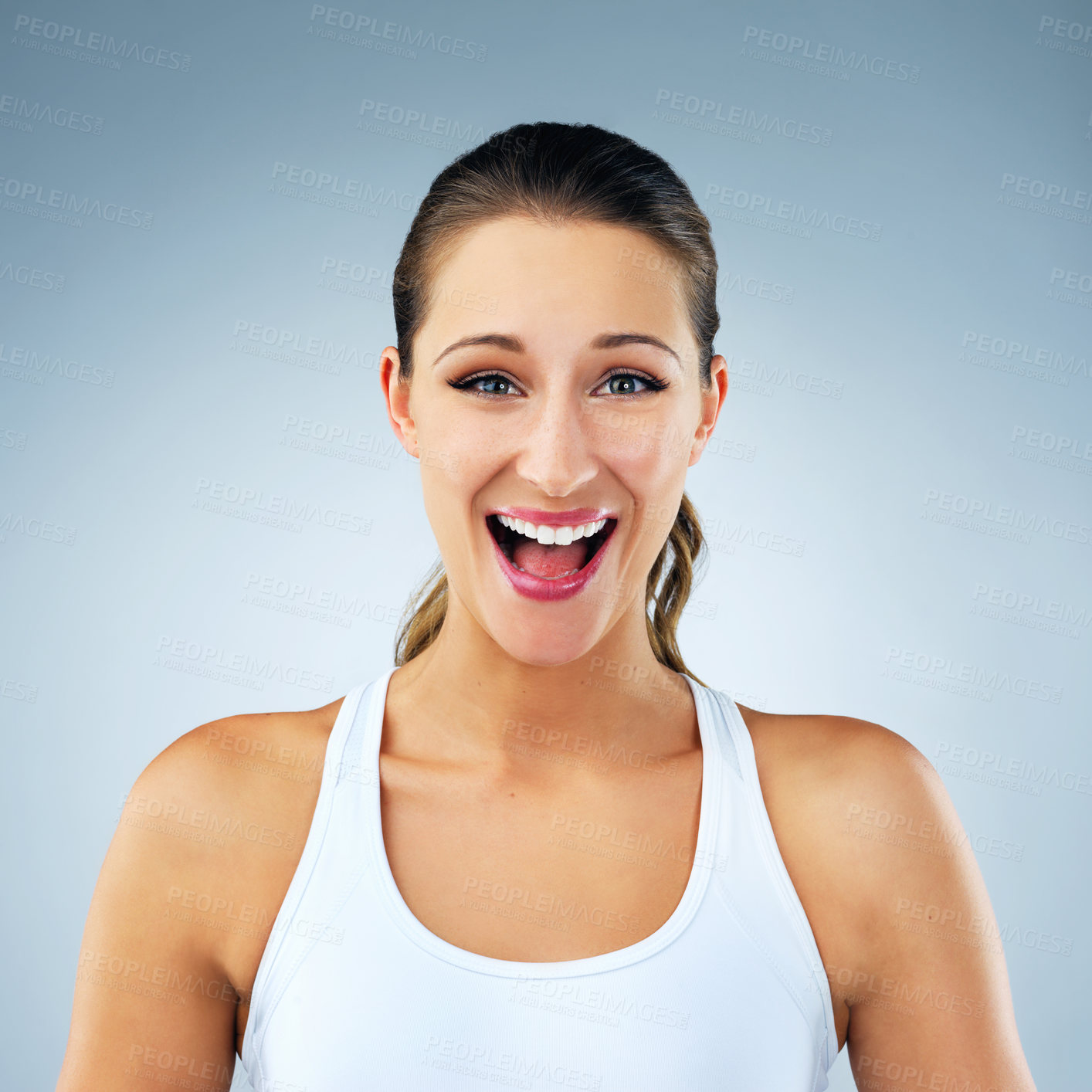 Buy stock photo Studio shot of a beautiful and healthy young woman against a blue background