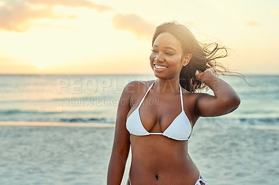 Buy stock photo Woman, happiness and sunset on beach for travel, summer and tropical vacation in Bahamas with bikini. Female person, smile and dusk by ocean for holiday, adventure and relax with swimwear or wind