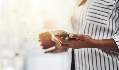 Buy stock photo Cropped shot of a woman using her cellphone