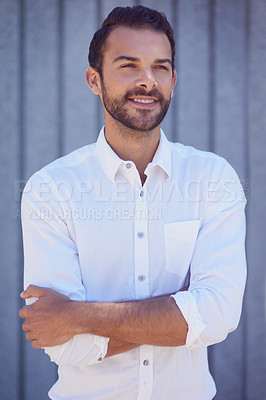 Buy stock photo Shot of a well-dressed young man posing outside