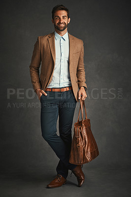 Buy stock photo Man, portrait and studio with luggage for style, work gear and smart casual fashion for professional confidence. Male professor, gray background and bag with jacket or cool, trendy blazer in Chicago