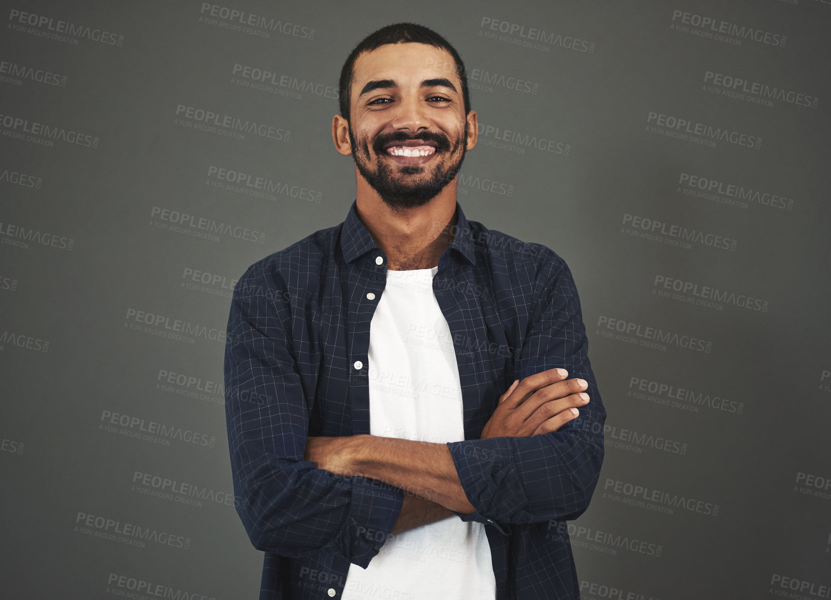 Buy stock photo Crossed arms, designer or portrait of happy man with fashion, pride and confidence in studio. Trendy model, male person or entrepreneur with smile, mockup space or style isolated on dark background
