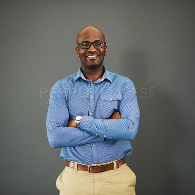 Buy stock photo Business ceo, black man and portrait with arms crossed in a studio feeling proud from auditor work. Gray background, smile and African employee with success and leadership vision with glasses
