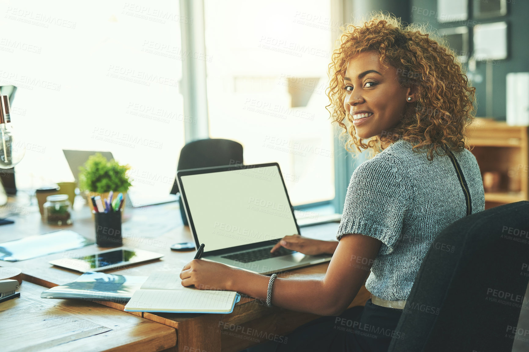 Buy stock photo Portrait of a young businesswoman working in an office