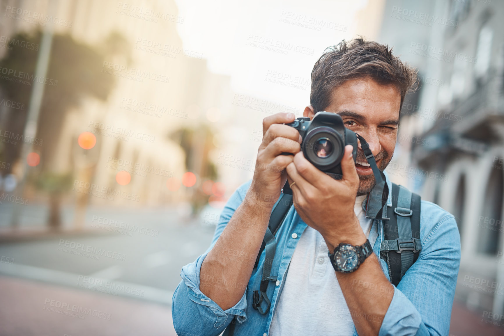 Buy stock photo Photographer, portrait and man with camera, memory and travel with creativity, vacation and urban explore. Male person, journey and city journalist for photography, research and tourism adventure