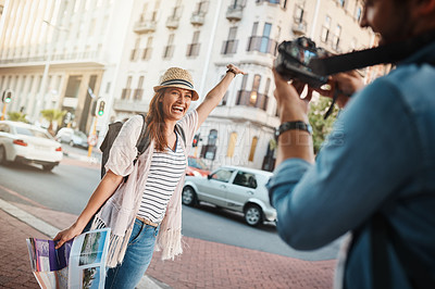 Buy stock photo Shot of a woman posing for a picture while out in a foreign city