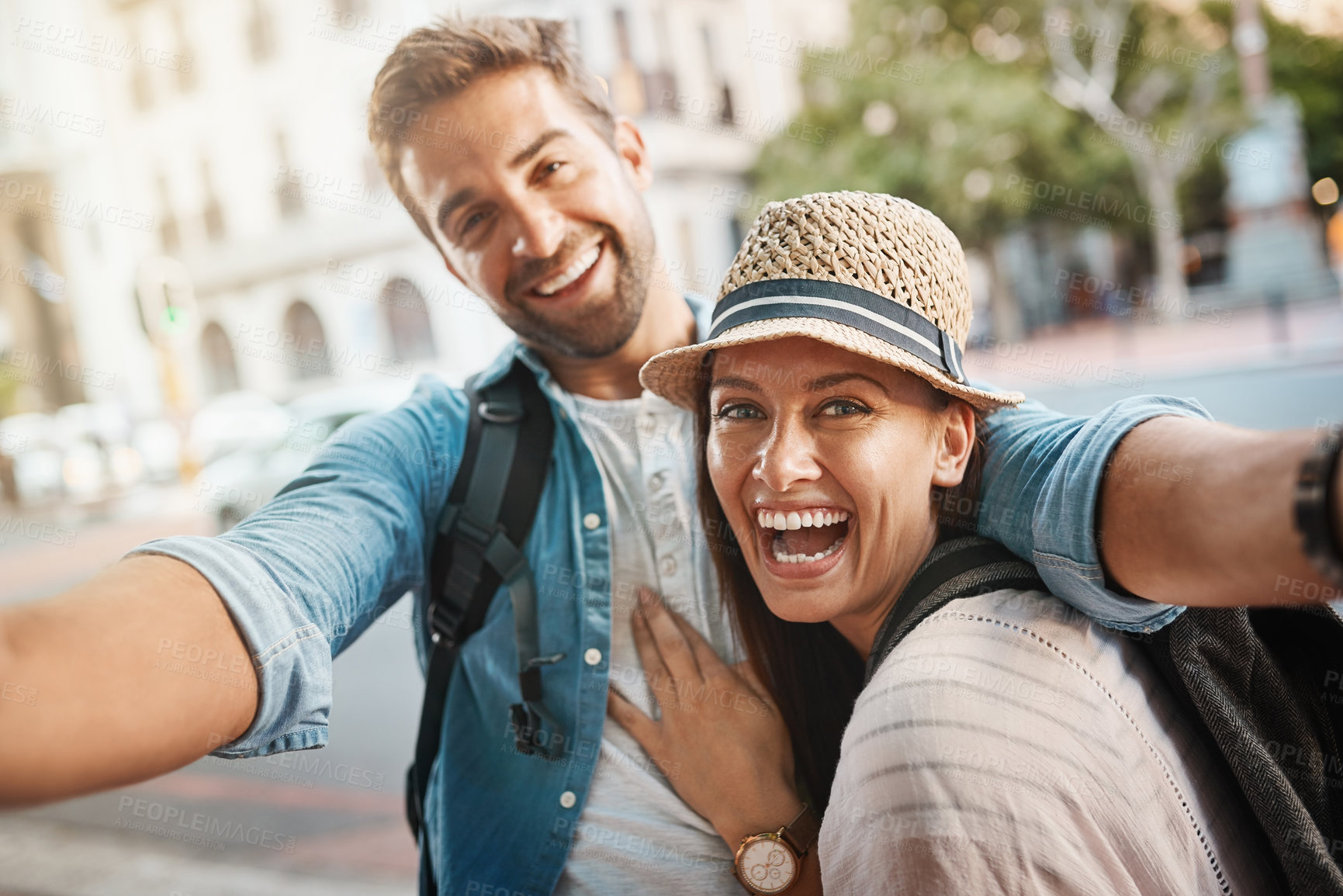 Buy stock photo Tourist selfie, happy couple and outdoor for travel on a city street for happiness and holiday memory. Face of a man and a woman laughing on urban road for adventure, journey or vacation for freedom