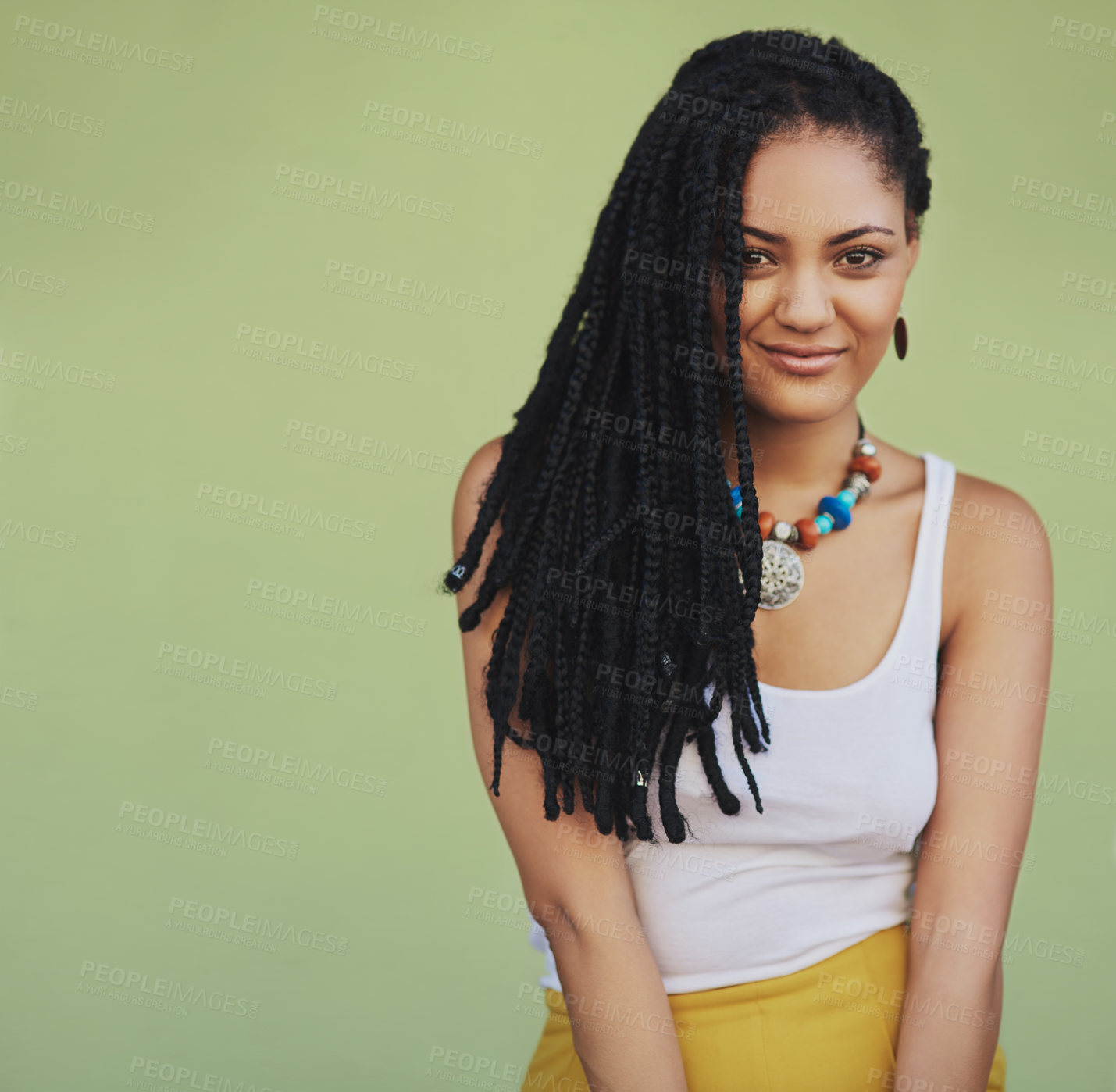 Buy stock photo Dreadlocks, fashion and portrait of woman in studio for summer clothes, necklace and trendy style. Confident, smile and person with pride for outfit, jewellery and accessories on green background