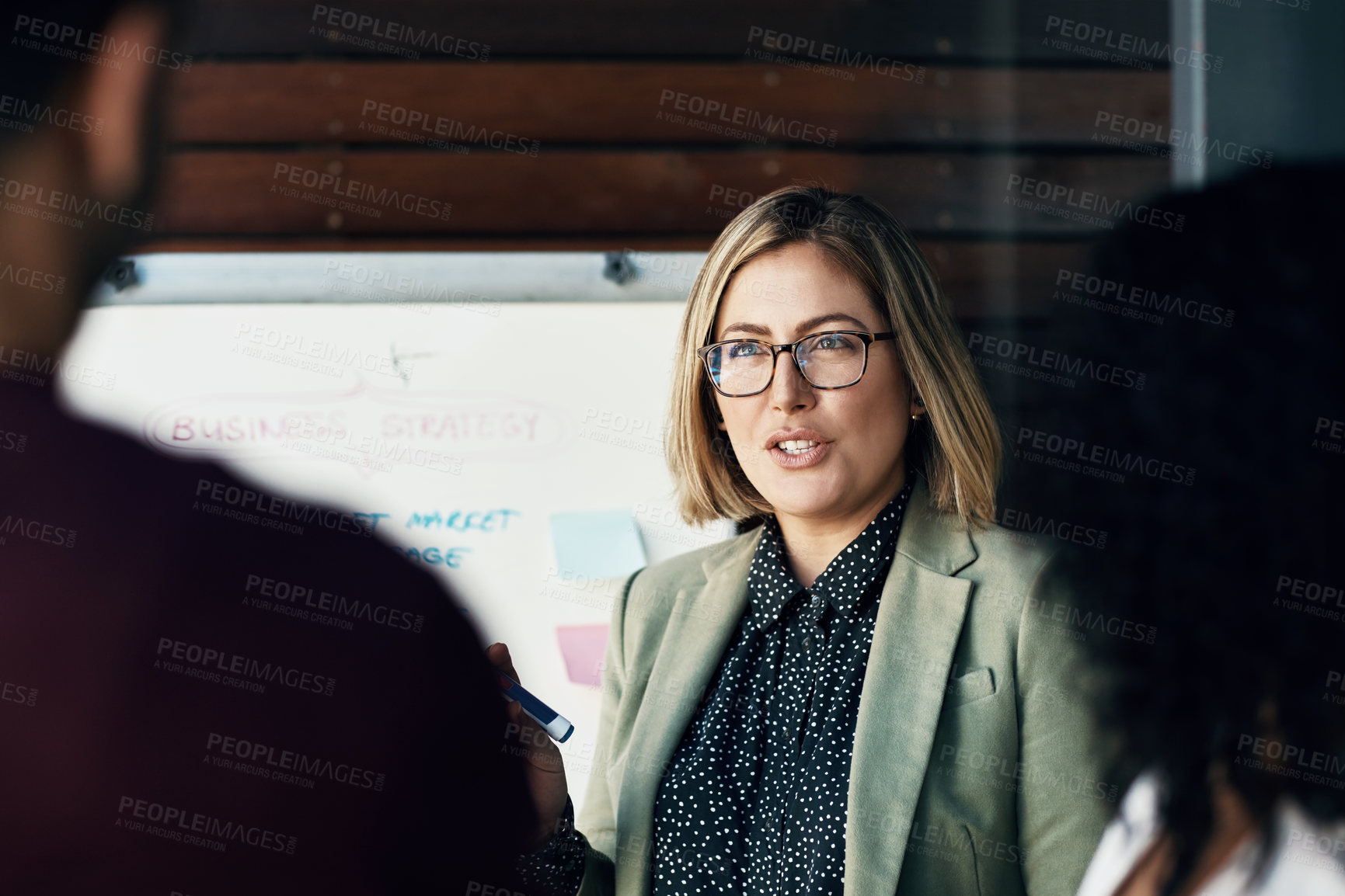 Buy stock photo Shot of a group of colleagues having a brainstorming session in a modern office