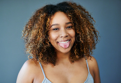 Buy stock photo Happy, tongue out or African woman with hair care, portrait or natural afro for beauty or cosmetics. Gray background, funny face or confident model in studio with growth, texture or joke in Somalia