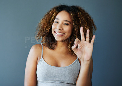 Buy stock photo Girl, smile and ok sign with studio portrait, emoji and decision with agreement by background. Woman, person and model with pride with icon, symbol and happy for choice with confidence in Costa Rica