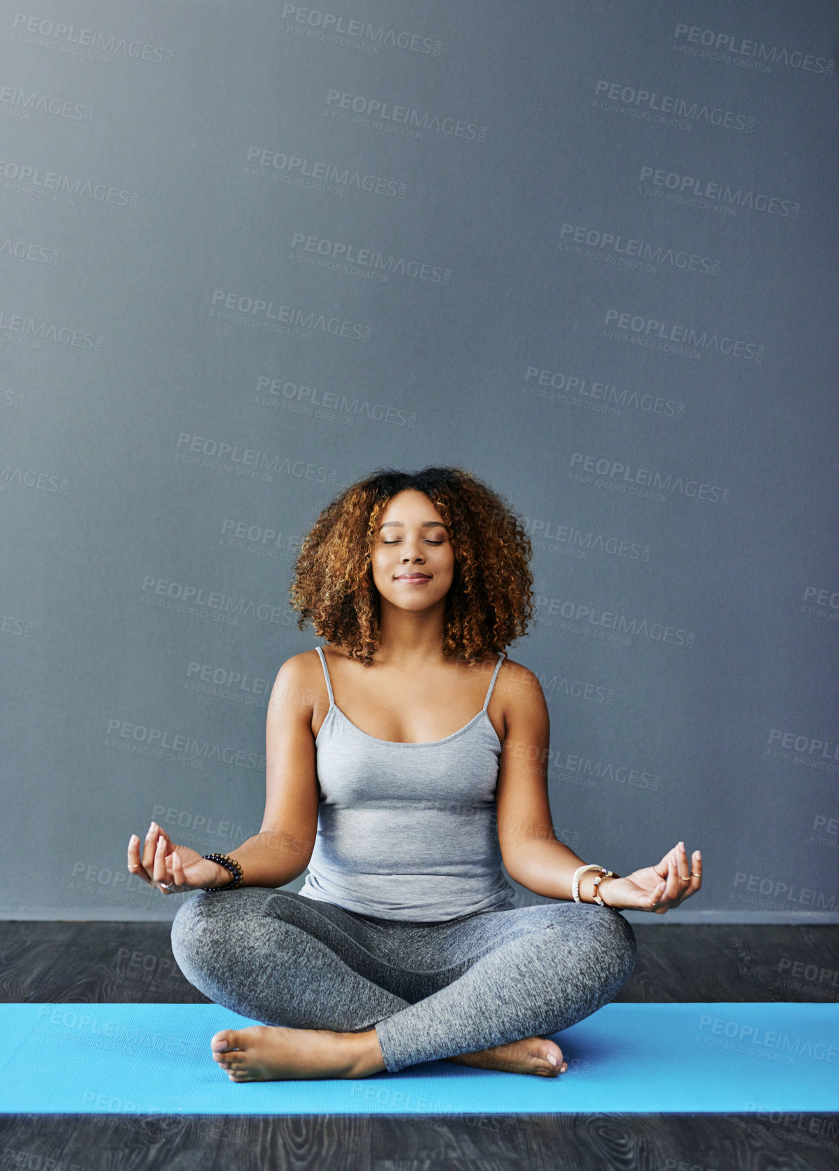 Buy stock photo Woman, smile and relax with meditation in home for chakra balance, mindfulness and mental health. Calm, person and zen on mat with holistic healing exercise for spiritual, awareness and inner peace