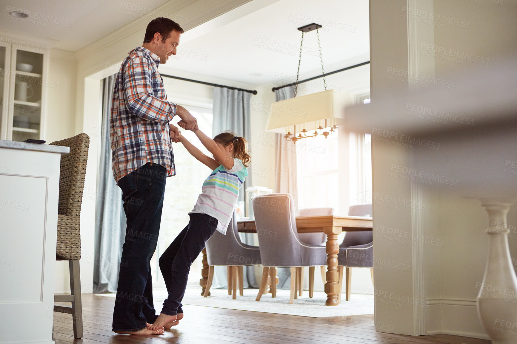 Buy stock photo Dad, girl or dancing in home on feet together, growth or development with role model. Father, happy dancer or playful in house for learning or bonding, parent with support or trust for fathers day