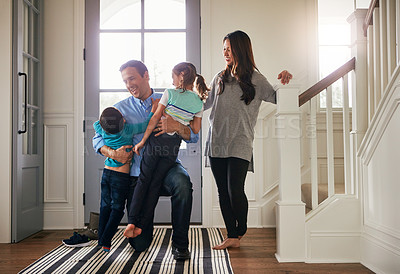 Buy stock photo Home, front door and father with children hug for greeting, welcome and excited for return. Family, hello and happy mother, dad and kids in house embrace for affection, relationship and bonding