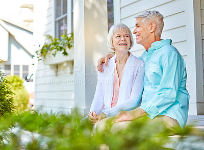 Buy stock photo Cropped shot of an affectionate senior couple sitting outside on their porch during the summer