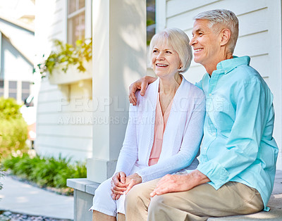 Buy stock photo Cropped shot of an affectionate senior couple sitting outside on their porch during the summer