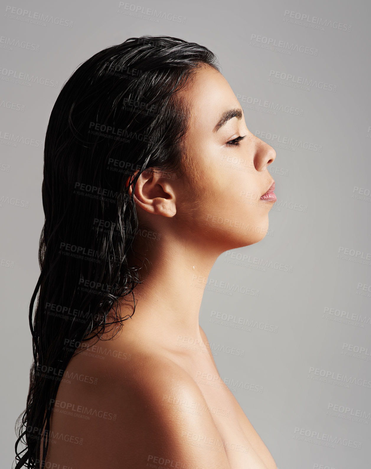 Buy stock photo Woman, profile and beauty salon with haircare, cosmetics or shower on a gray studio background. Young female person or model with wet hair for spa wash, hygiene or keratin treatment on mockup space