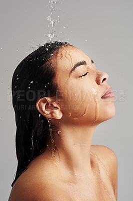 Buy stock photo Shower, washing and face of woman with water in studio on grey background for wellness, cleaning and grooming. Hair care, bathroom and female person with beauty for hygiene, satisfaction and health