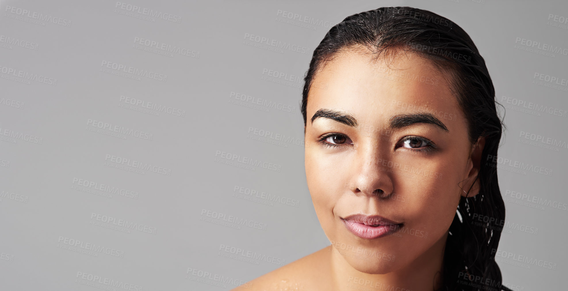 Buy stock photo Woman, portrait and beauty with makeup, haircare or skincare cosmetics on a gray studio background. Face of young female person or model with wet hair for hygiene or facial treatment on mockup space