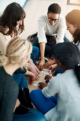 Buy stock photo Diversity, group and puzzle on floor with teamwork, support and solution for problem. Partnership, synergy and global women with jigsaw for collaboration strategy, together and sitting in circle
